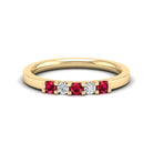 Alternating diamond and ruby gemstones in 14k yellow gold on a white background